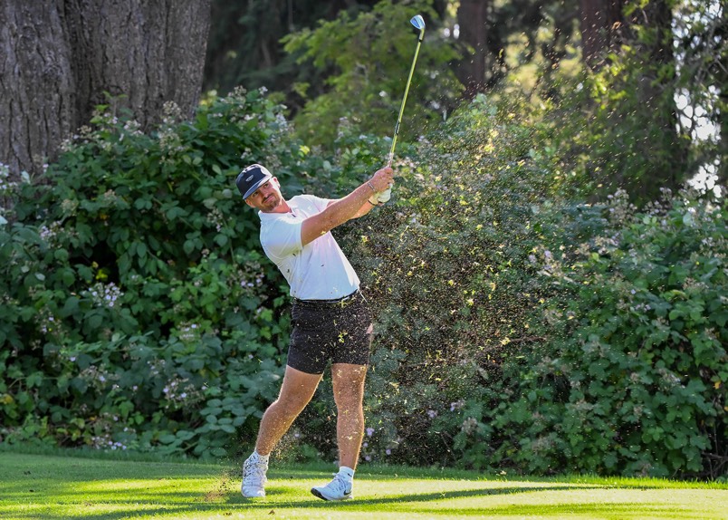 Micah Houston following through on an iron shot